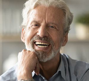 Man smiling with All-On-4 dental implants
