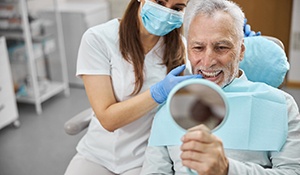 An aging gentleman happy with his new dental implant