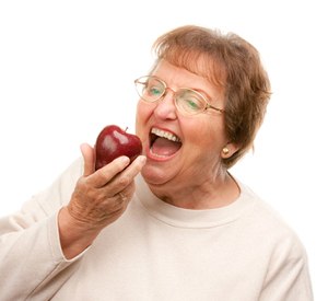 woman biting an apple