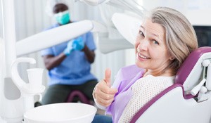 Woman smiling after getting dental implants in Richardson 