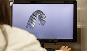 Dental team member working on computer