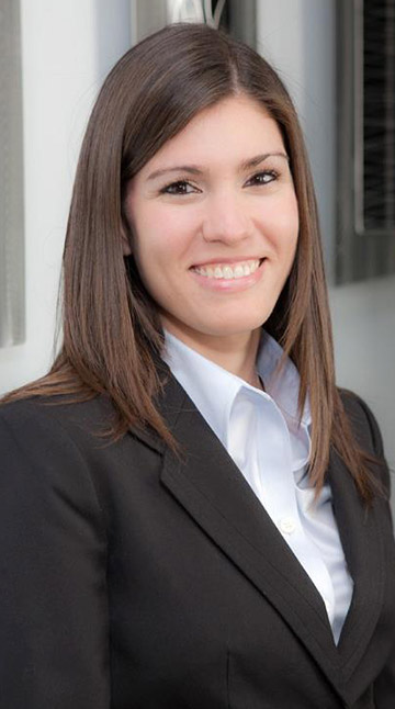 Dr. Yaritza Vazquez wearing suit smiling