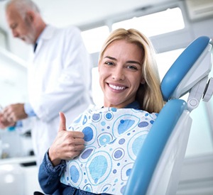 smiling woman in dental chair about to receive nitrous oxide sedation in Richardson 