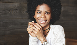 Young teen girl  holding hands together smiling