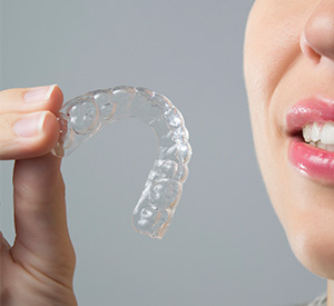 woman holding retainer