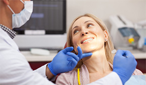 woman happy in dental chair