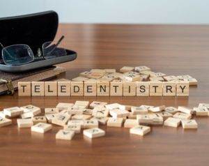 Teledentistry spelled out in tile letters